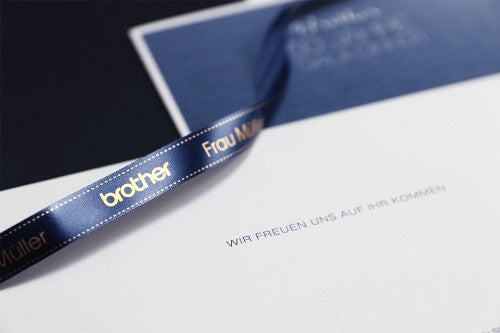 Brother TZE-RN34 label-making tape Gold on navy
