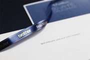 Brother TZE-RN34 label-making tape Gold on navy